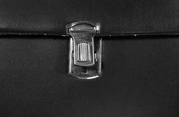 istock Open metal buckle on textured black leather 537810804