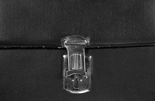 istock Open metal buckle on textured black leather 537810826