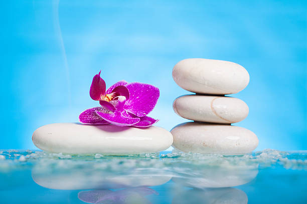 istock Spa still life with pink orchid and white zen stone 537816223