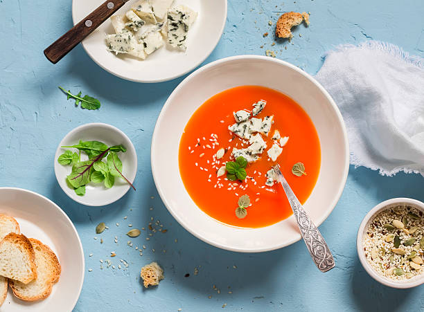 istock Pumpkin soup with blue cheese on a blue stone background 537816666