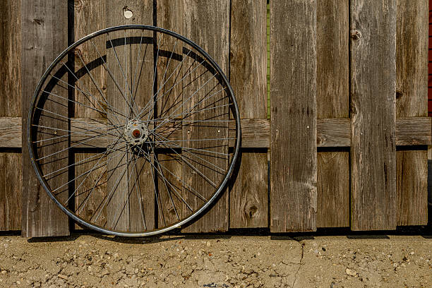 istock Bicycle wheel near a fence 537817080