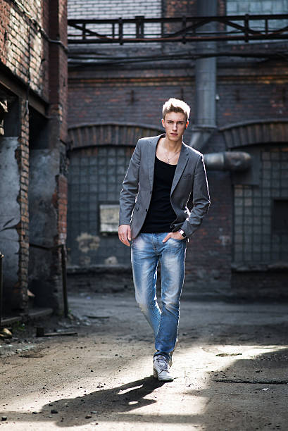 istock Young attractive man on abandoned background. Street 537817325