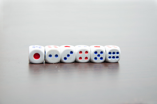 Dice on woodent table counting