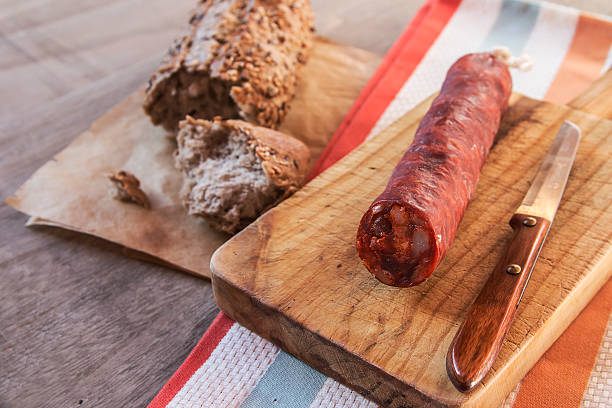 istock Spanish sausage with bread over a wooden table 537817585