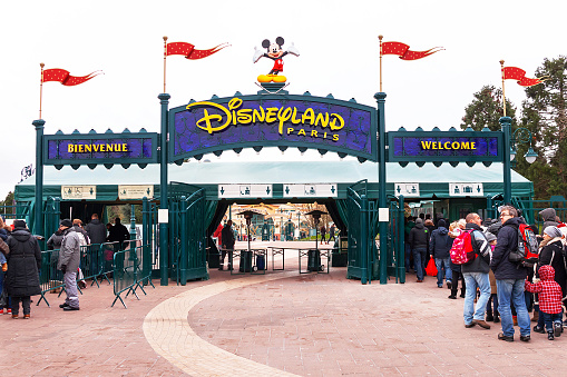 Paris, France - January 12, 2015: Main entrance (gate) to the Disneyland Paris. Disneyland is one of  the most popular destinations in Paris. Travel (vacation), entertainment, childhood concept. France. Europe. 