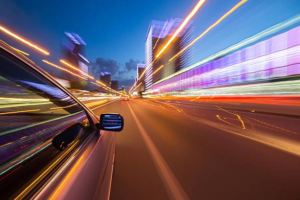 istock night city drive by car 537818024