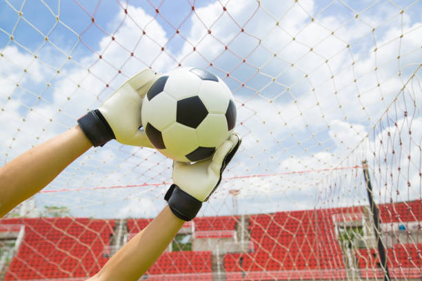 istock Goalkeeper used hands for catches the ball 537818191