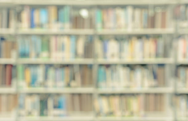 istock Blurred abstract background of library with bookshelves 537818546
