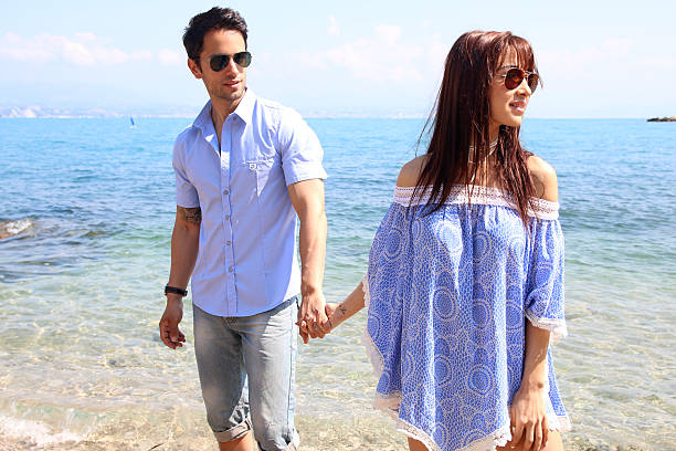 istock beautiful couple at the beach 537819176