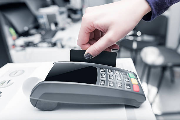 istock Debit card swiping on pos terminal. 537820220
