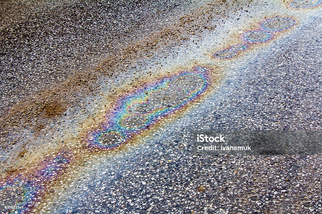 Petrol spill Oil spill on asphalt road as texture or background 2015 Stock Photo