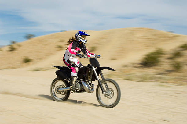 motocross racers - desert women female adult zdjęcia i obrazy z banku zdjęć