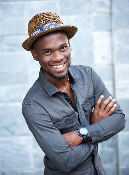 istock Handsome african american man smiling with arms crossed 537822509