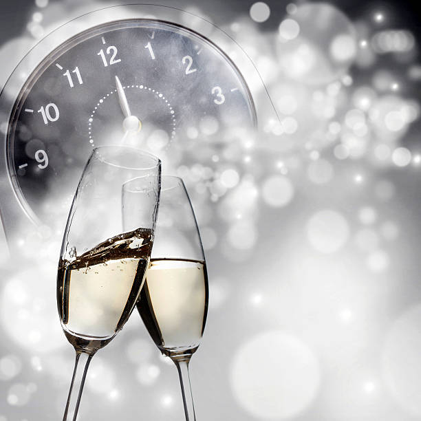 istock New Year's - toasting with champagne glasses against fireworks a 537822853