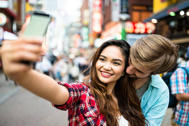 istock lovers take a selfie in Tokyo 537824392