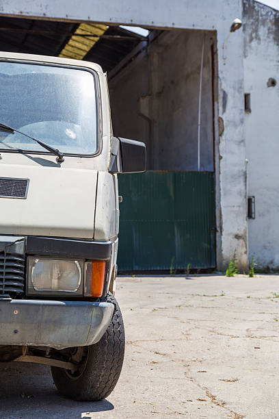 istock abadoned car near deserted storage 537825312