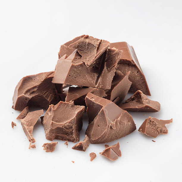 istock Pieces of milk chocolate isolated on white 537825598