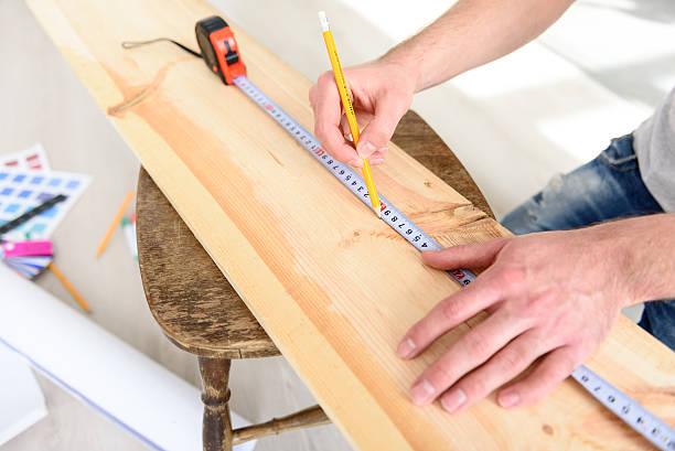 istock Man measuring piece of wood 537826726