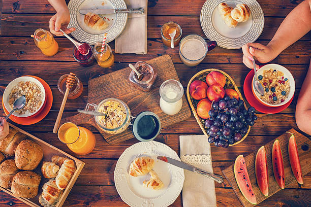 istock Young Happy Family Having Breakfast 537827288