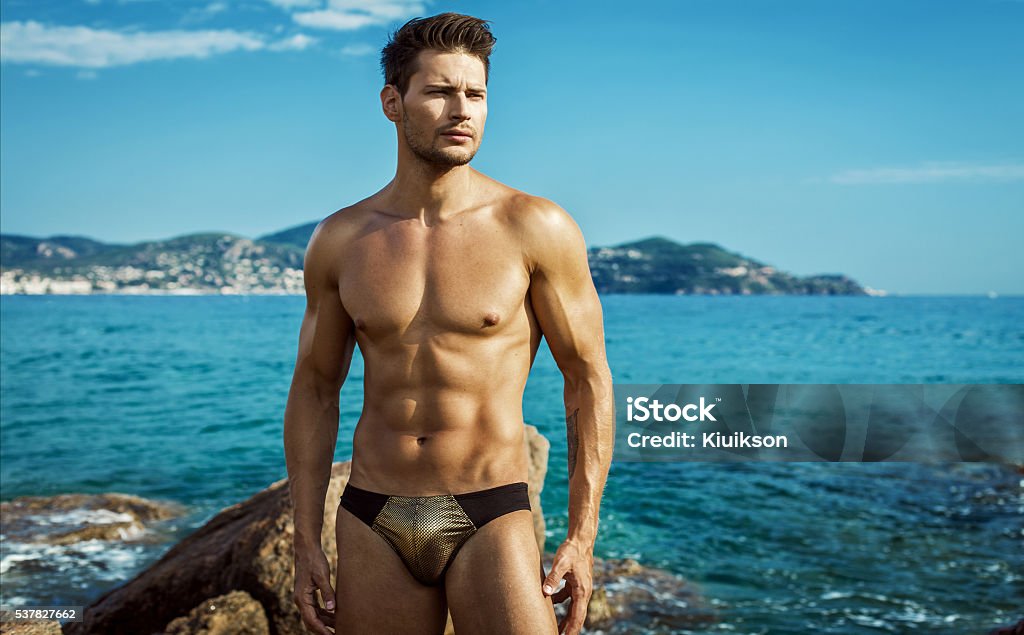 Sexy Male Model Wear Men's Underwear In Sea Scenery Naked Stock Photo