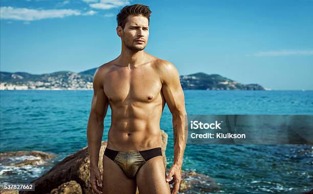 Sexy Male Model Wear Mens Underwear In Sea Scenery Stock Photo - Download Image Now