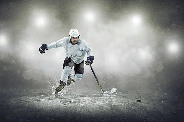 Photo of Ice hockey player on the ice, outdoors