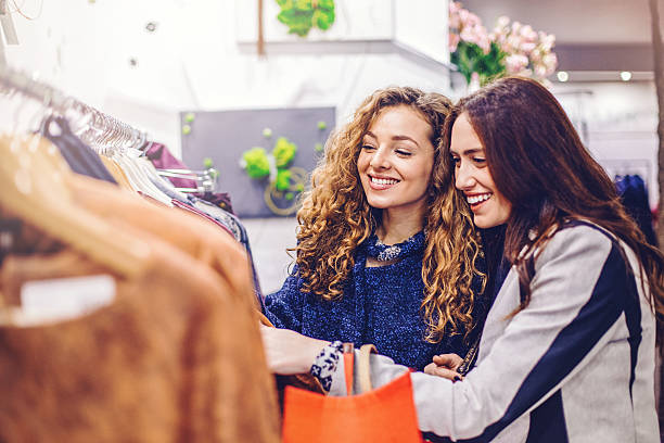 istock Girlfriends shopping in fashion store 537831984