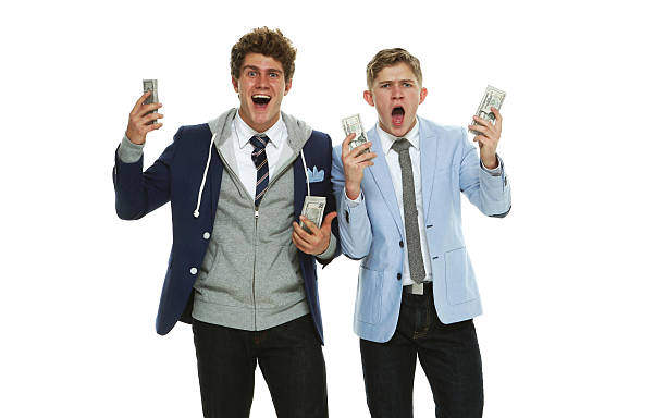 istock Excited brothers shouting with money 537834290