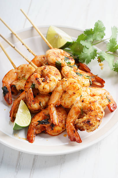 istock grilled shrimp kababs with sriracha and lime 537834694