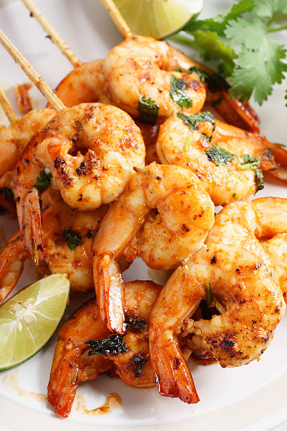 istock grilled shrimp kababs with sriracha and lime 537834902
