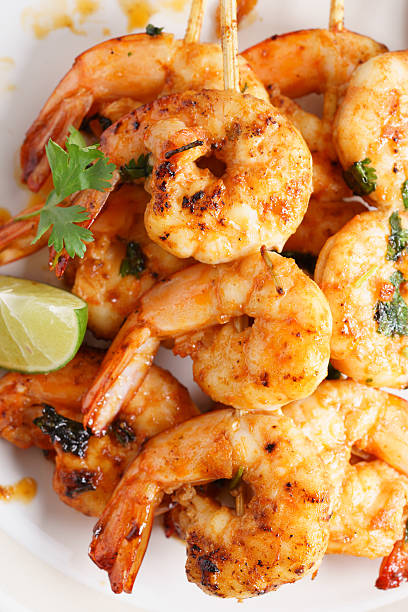 istock grilled shrimp kababs with sriracha and lime 537834982