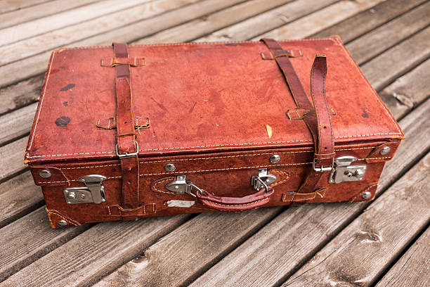 istock Old worn vintage brown leather suitcase 537838140