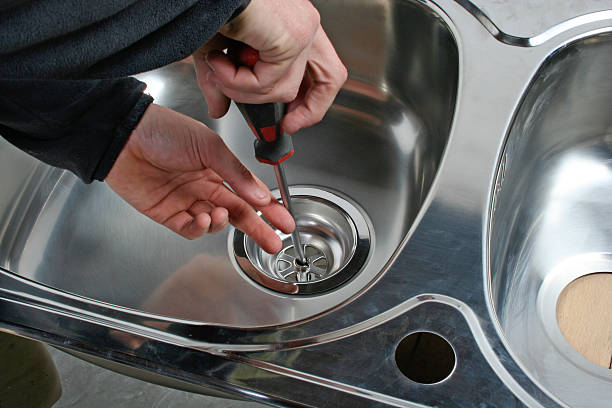 istock Plumber repairing drain of kitchen sink 537839464