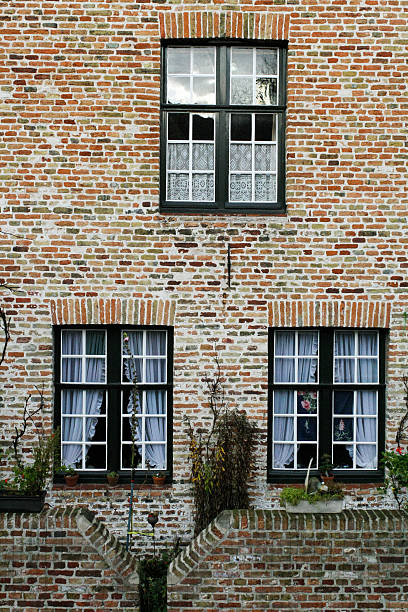 istock Wall of house from red brick with three windows 537844136