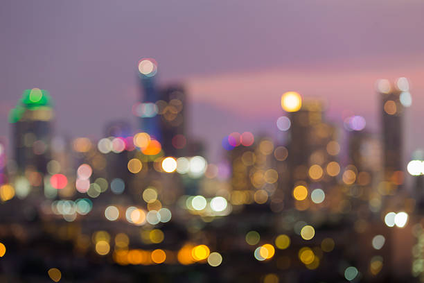 istock Blurred lights city office building during twilight 537850480