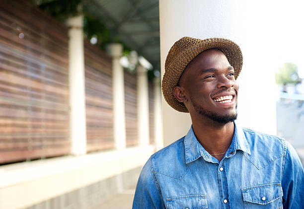 Carefree young african american man laughing