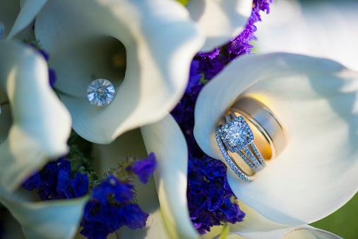 Wedding rings on the brides bouquet