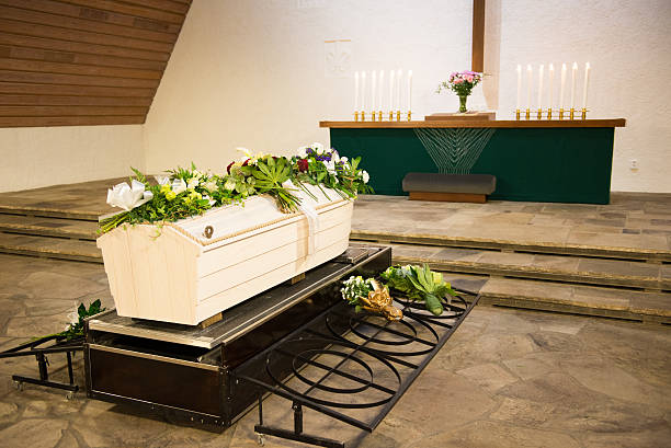 Funeral Coffin and flower arrangement. coffin crematorium stock pictures, royalty-free photos & images