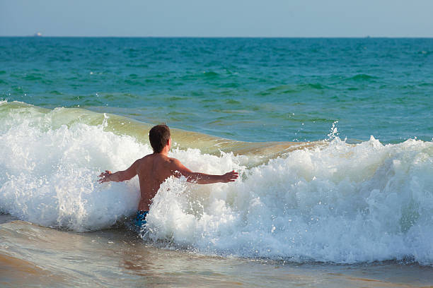 Man on the beach stock photo