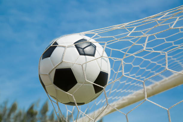 istock Soccer ball in the goal after shooted 537853035