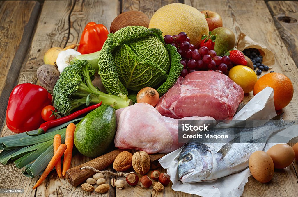 Paleo diet products Various Paleo diet products on wooden table Fish Stock Photo
