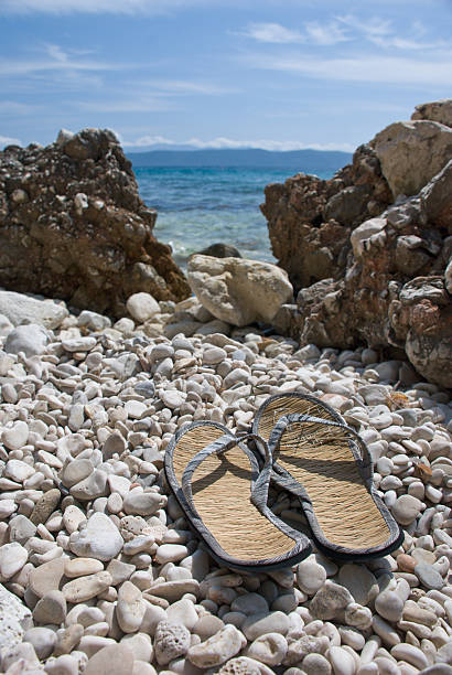 istock Flip-flops on the Croatian stone beach 537855567
