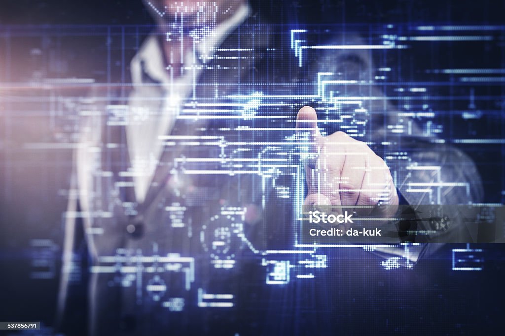 Businessman working with modern computer Businessman working with modern computer designing a digital structure. Stock photo. HUD - Graphical User Interface Stock Photo