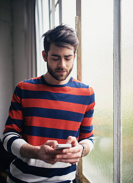 istock Young man chatting on the phone 537862720