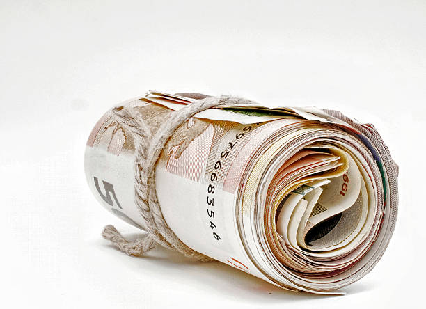 istock rolled large amount of bills 537864488