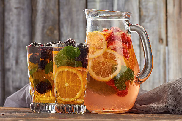 istock Summer fruit drink on wooden background 537865034