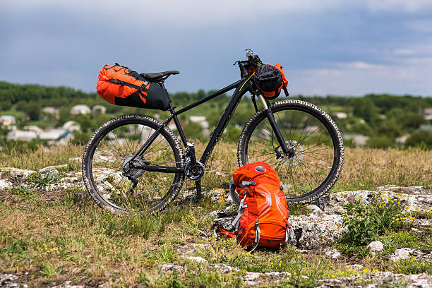 istock Bicycle with orange bags for travel 537865250