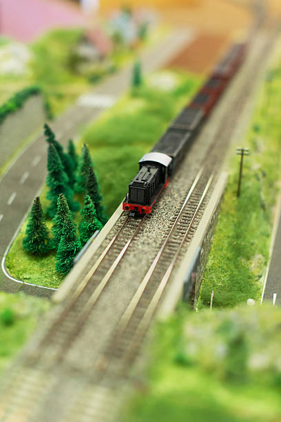 istock City in miniature. Miniature model of train with wagons. 537865364
