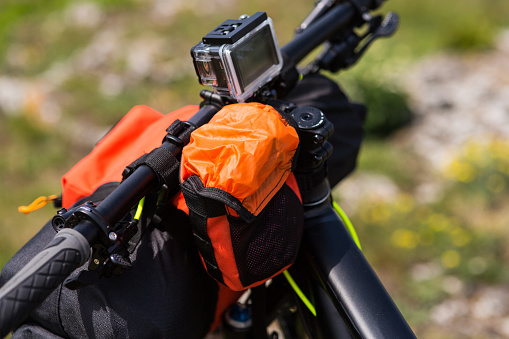 Mountain Bicycle outdoor with orange bags for travel