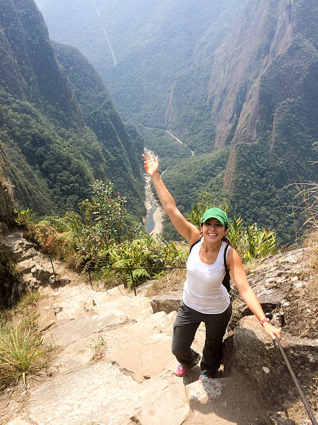 Tourist visiting Machu Picchu ruins in Peru